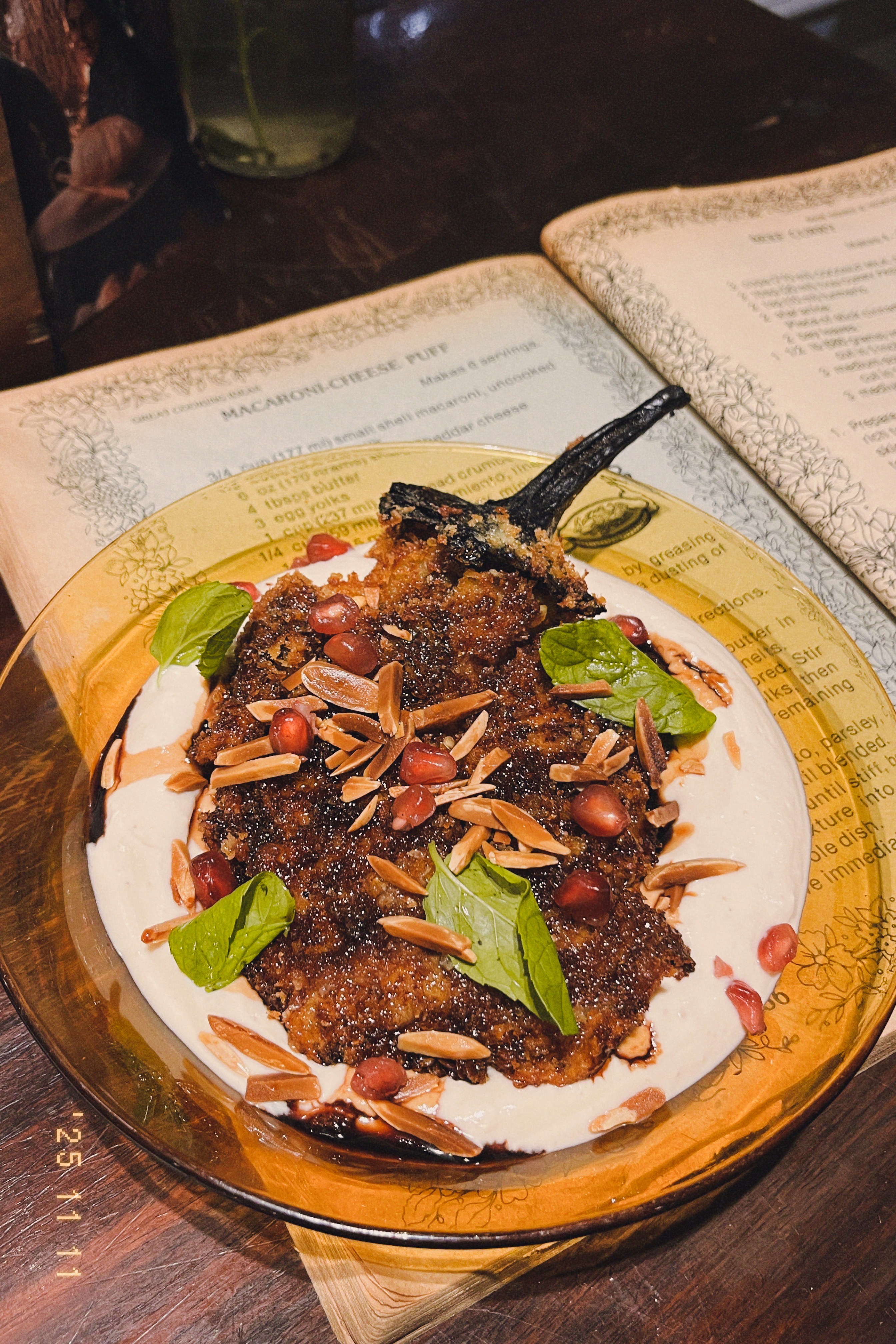 Crisp whole fried eggplant with almonds, pomegranate and yogurt
